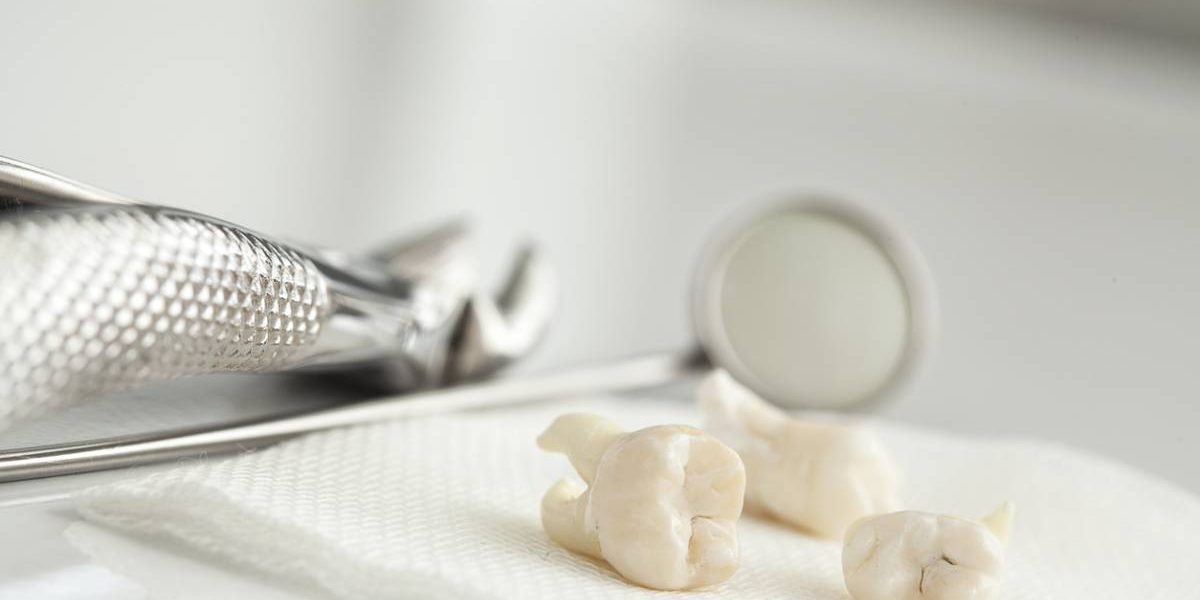 Two teeth and dental instruments being shown.