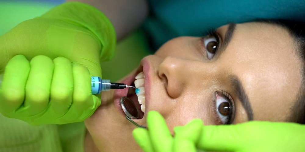 Patient getting dental work done.