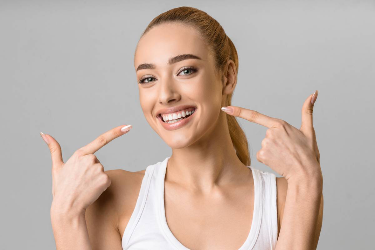 concept of woman with whiten teeth treatment