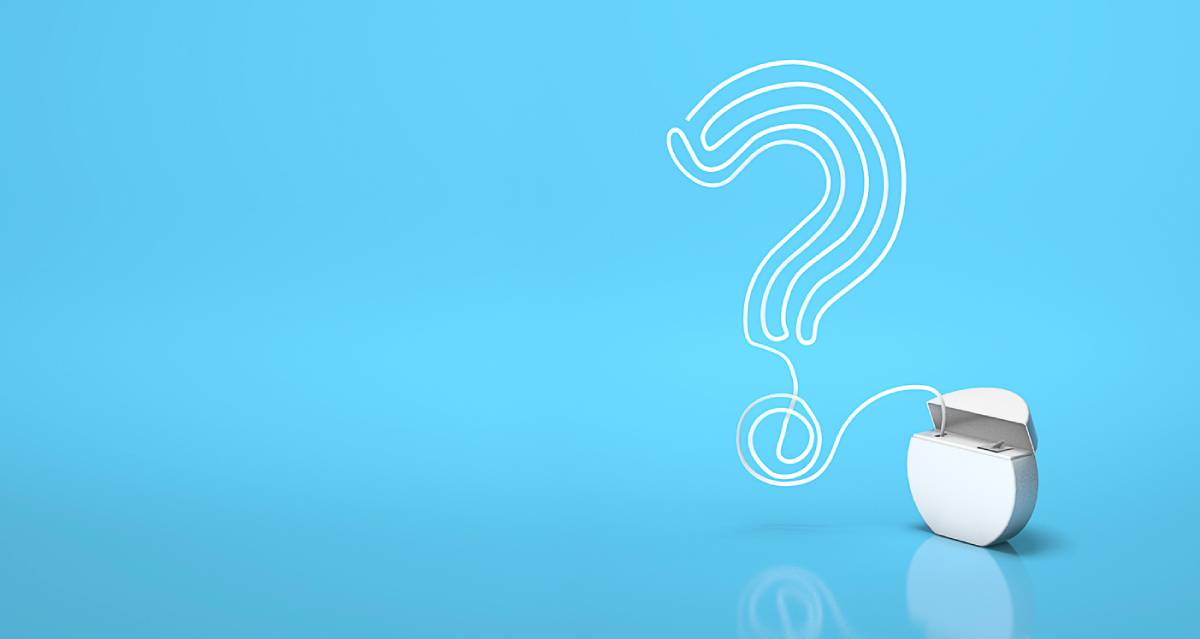Concept image for wondering if you should floss dental implants